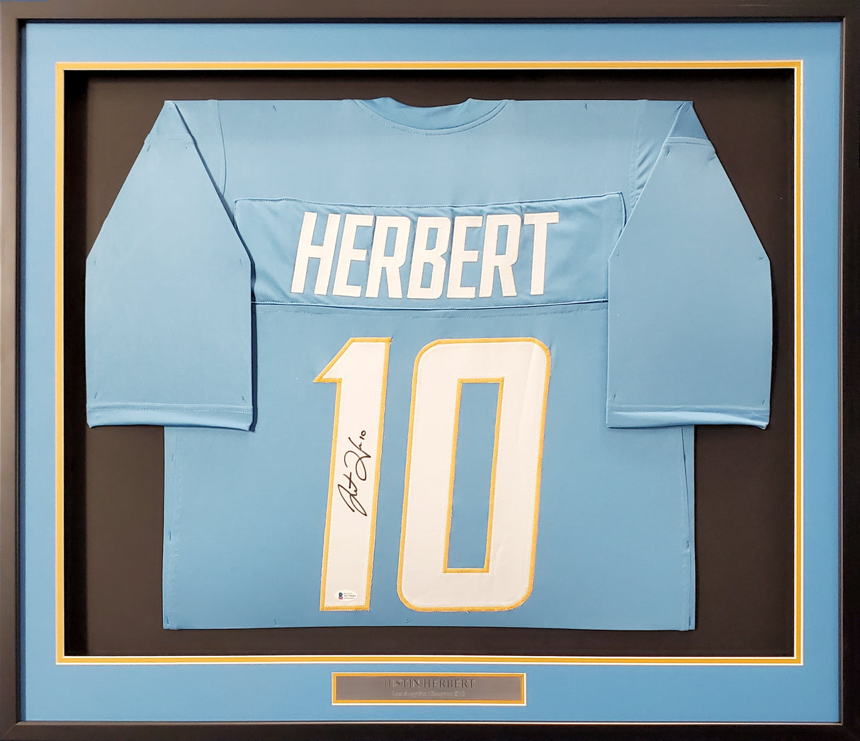 Los Angeles Chargers Justin Herbert Autographed Framed Powder Blue Jersey Beckett BAS Stock #191176