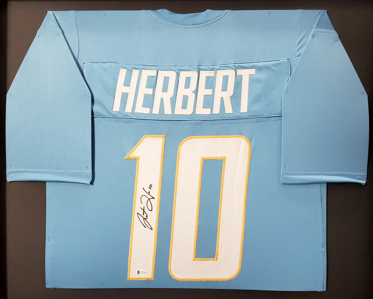 Los Angeles Chargers Justin Herbert Autographed Framed Powder Blue Jersey Beckett BAS Stock #191176