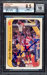 Hakeem Olajuwon Autographed 1986-87 Fleer Stickers Rookie Card #9 Houston Rockets BGS 8.5 Auto Grade Gem Mint 10 Beckett BAS #15530343